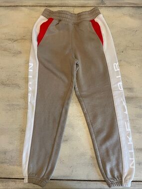 Nike Gray Joggers with White Side Panels and Red Accents